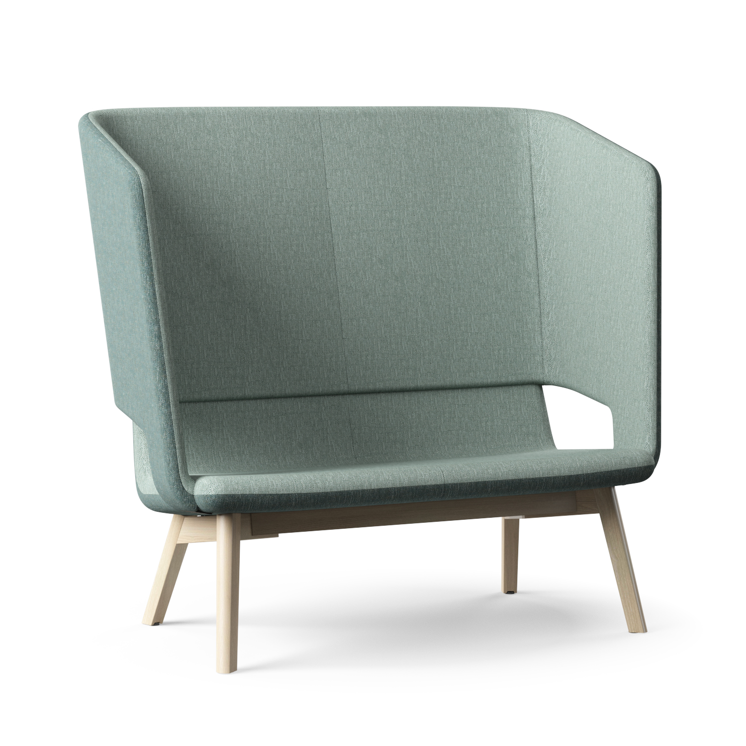 Lysegrøn, betrukket sofa med omsluttende ryglæn og bløde, polstrede flader. Designet har afrundede hjørner, en åben udskæring i den ene side og slanke, lyse træben som kontrast. Overfladen viser fin vævet tekstur, og formen virker minimalistisk og indbydende i et lyst, neutralt miljø.